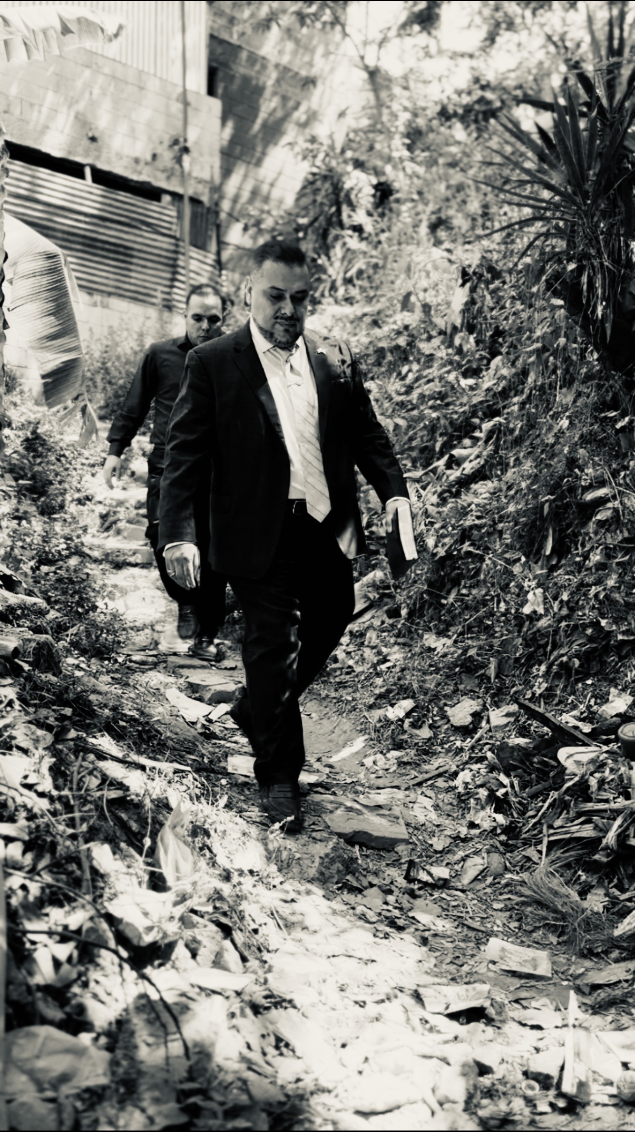 Pastor Glenn Parada walking in what use to be gang (mara) territory in El Salvador